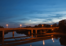 night-bridge bridge over a river lit up for night